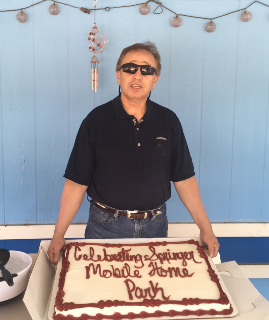Pictured above, Louie Ortiz with the cake commemorating his mobile home park in Springer for nearly 50 years in business. Photo by Sherry Goodyear.
