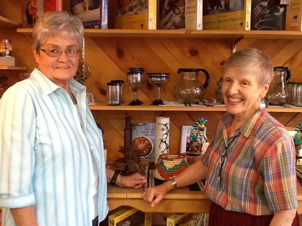 Martha Phelps (right) of Santa Fe Trail Traders and Sue McKillip (left) are ready to help you find the perfect gift. Not pictured, Annetta Berg, Georgia Pillmore, and Amanda Berry, who are also here to help you. Photo by Debi Sporleder