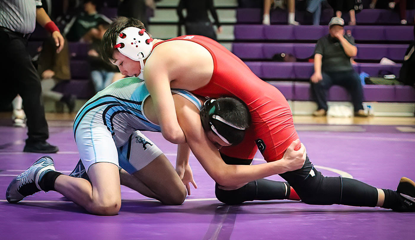 Dolores’ Kenji Edward and Trinidad’s Damien Ossola grapple in an early bout at 120 lbs.