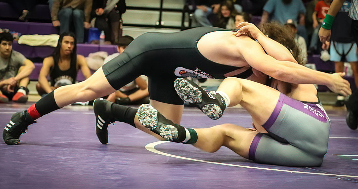 Skyler Moore of Rye and Aedin Orja of Primero get intense on the mats during their 165lb. Match. More won by points 16-4.
