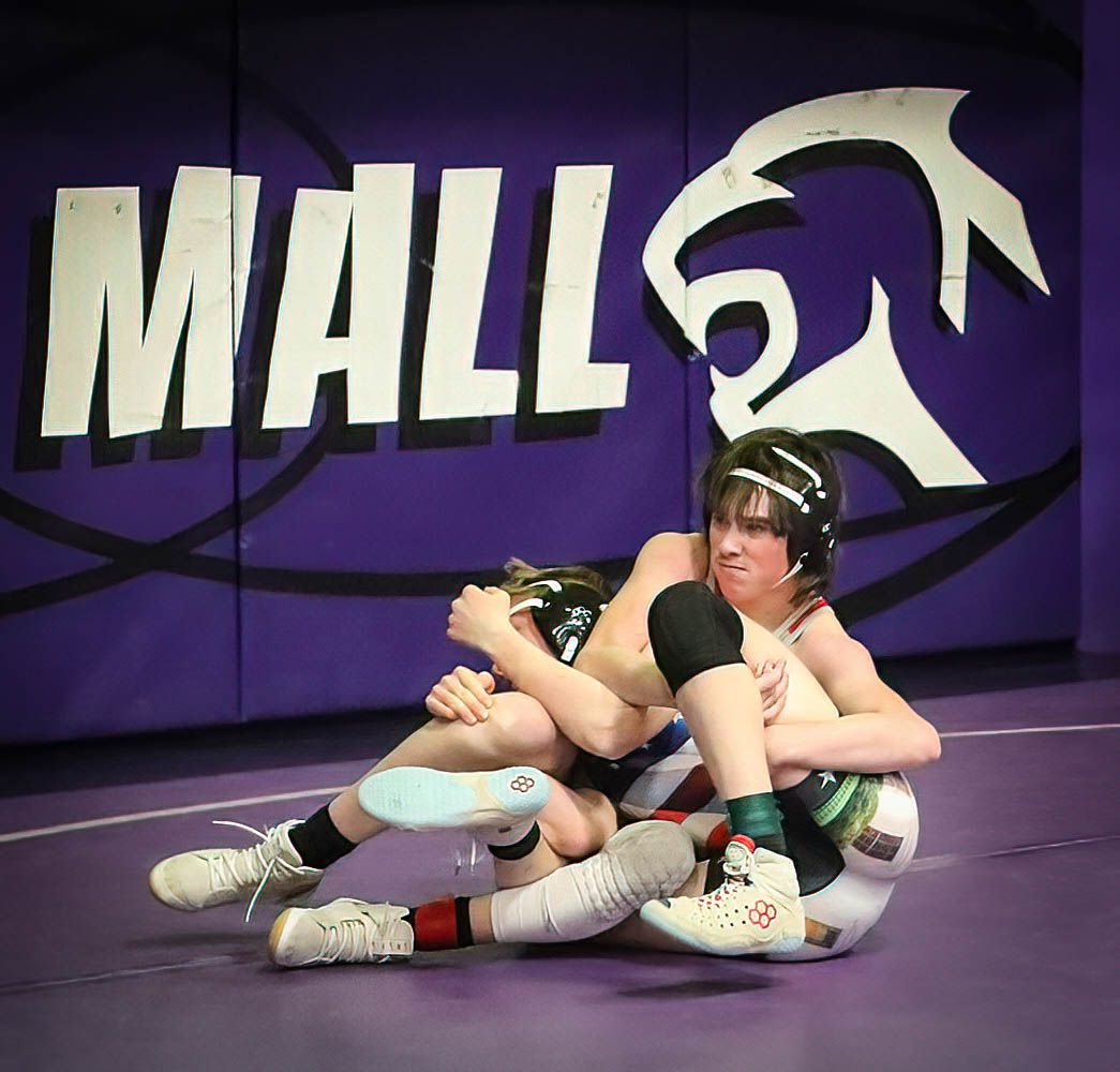 Alex Baril of Simla ties up Silviano Gonzales of Walsenburg under the John Mall banner in this 138 lb. match, Gonzales won the consolation match 12-2.